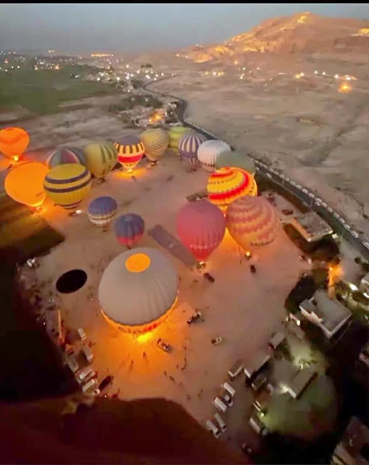 Hot air balloons over Luxor at sunrise